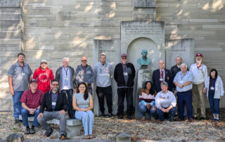 Howe Alums gathered in front of the McKenzie Memorial